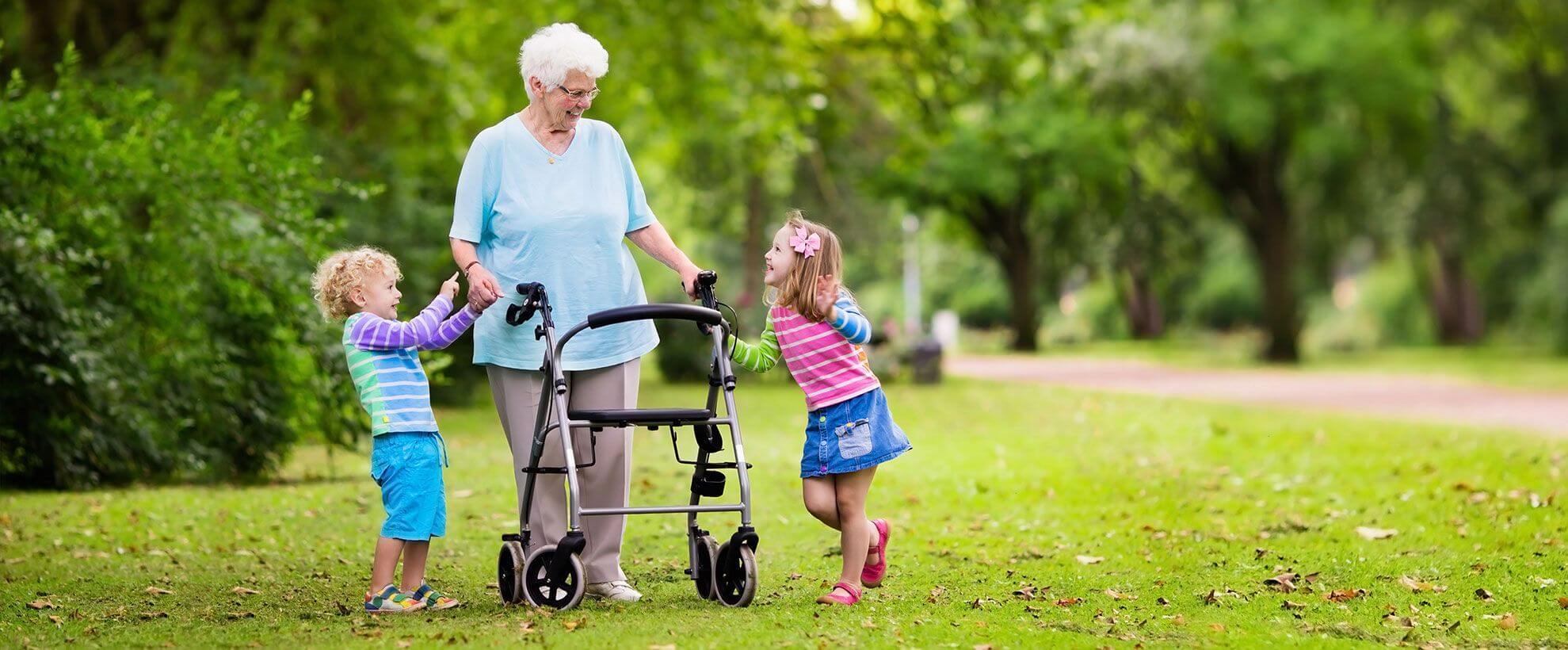 woman with walker playing with children